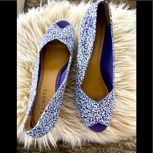 Blue and white peep toe espadrille wedges.